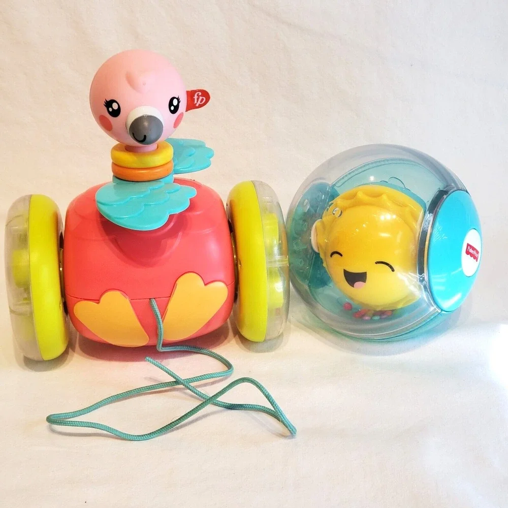 Fisher Price Paradise Pals Flamingo Roll A Round Rainbow Smile Face Pull Toys